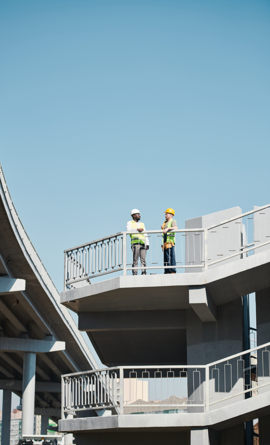 Workers on a bridge structure